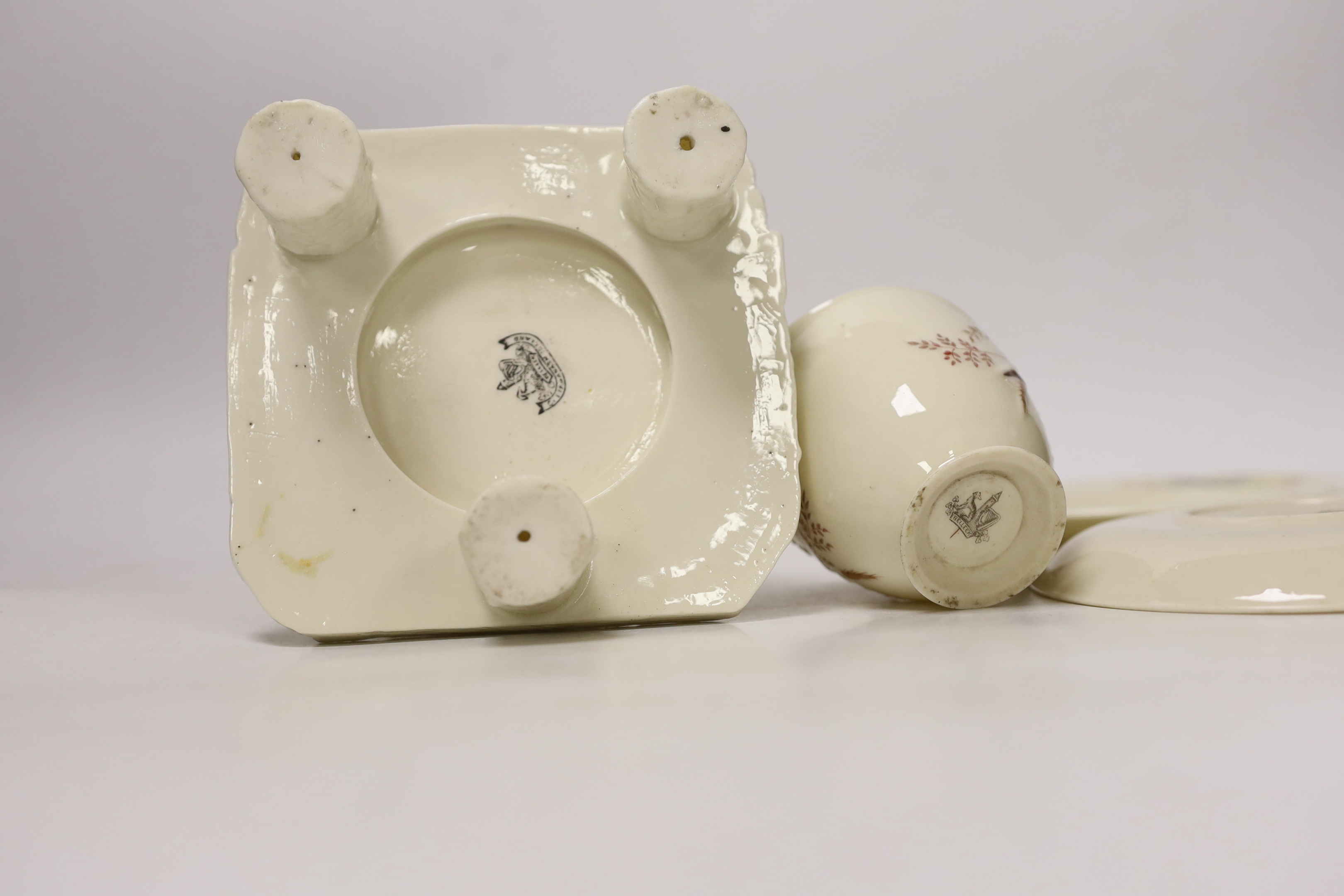 A small quantity of 1st and 2nd period Belleek including a ‘frog’ paperweight and a ‘beehive’ honey jar together with a related reference book by Marion Langham